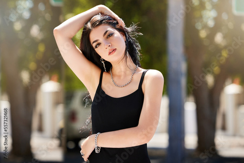 Designer fashion, young woman and outdoor portrait with trendy clothes and edgy style for gen z youth in park. Hair, mockup and beauty with stylish girl and fashion model with freedom and focus.