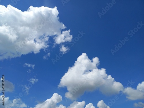 Blue sky on sunny day with some clouds for your background.