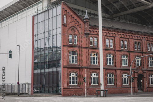 Modern windows wall with old vintage design of red brick building in Hamburg © Kaspars