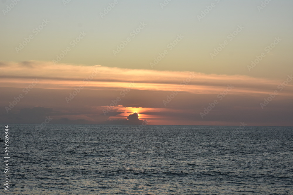 Fototapeta premium sunset over the sea in varkala beach, India