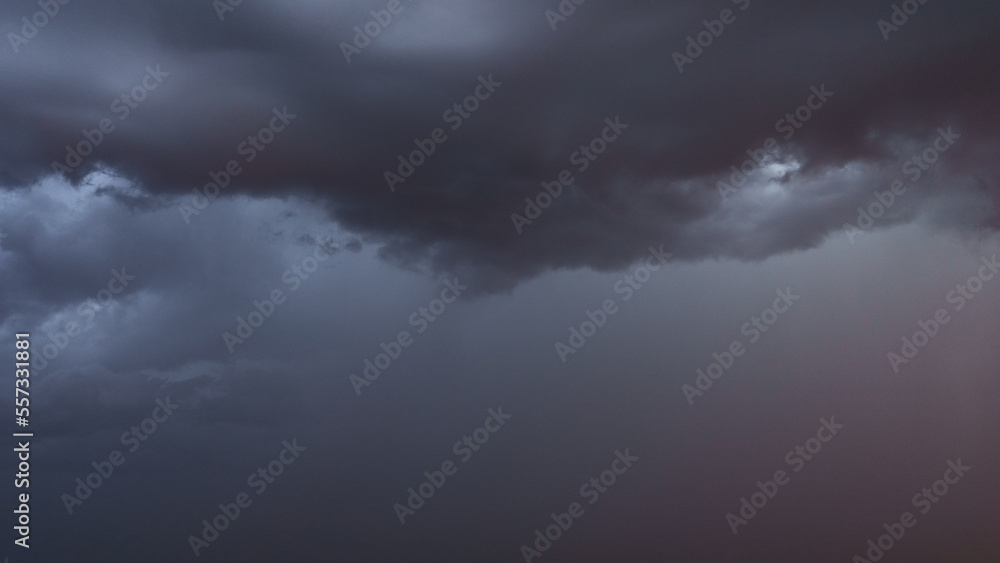 Obraz premium Detail shot of epic storm clouds during sunrise