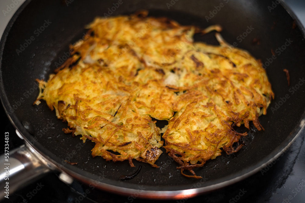 Homemade potato pancakes fried in hot oil. Homemade potato pancakes fried in hot oil.