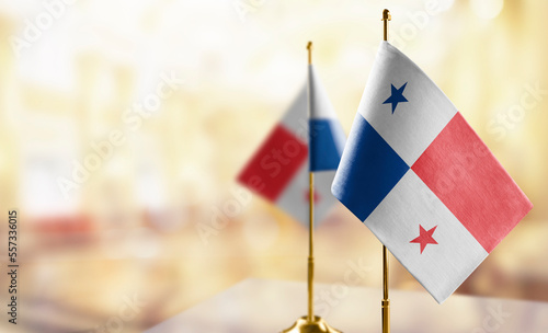 Small flags of the Panama on an abstract blurry background