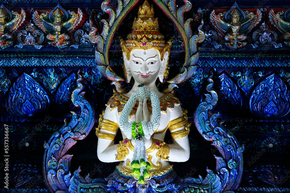 Fototapeta premium Detail of sculpture in Wat Rong Suea Ten, Temple of the Dancing Tiger, in the blue buddhist temple -Chiang Rai-Thailand