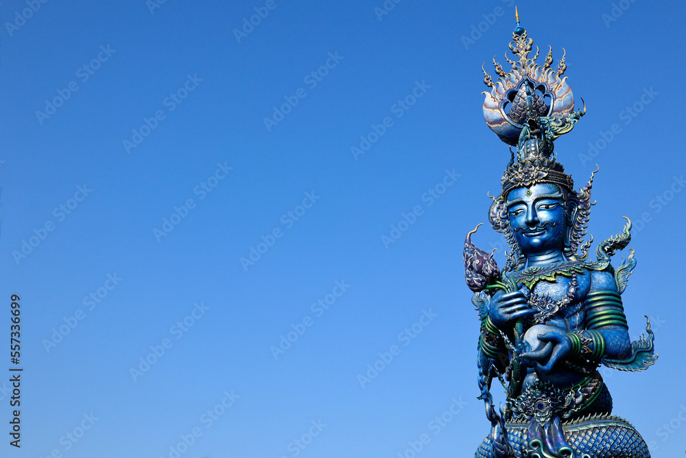 Fototapeta premium Detail of sculpture in Wat Rong Suea Ten, Temple of the Dancing Tiger, in the blue buddhist temple -Chiang Rai-Thailand