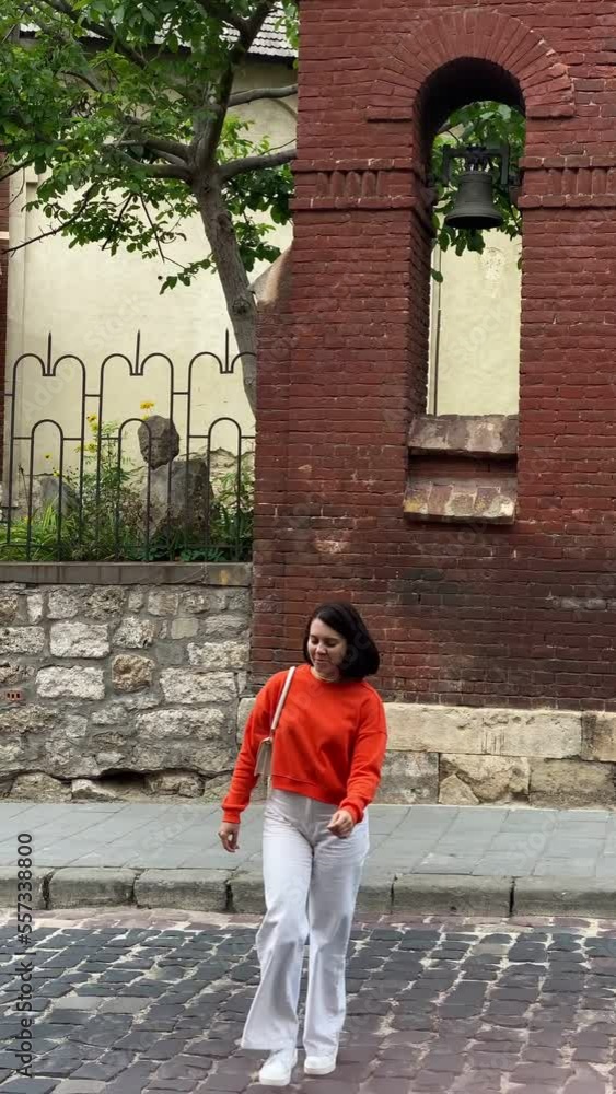 woman crossing by the road