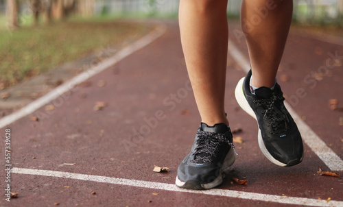 Woman enjoys running outside with beautiful view.