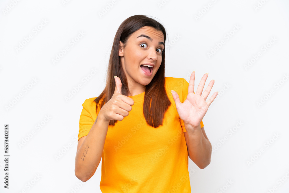 Young caucasian woman isolated on white background counting six with fingers Young caucasian woman isolated on white background counting six with fingers