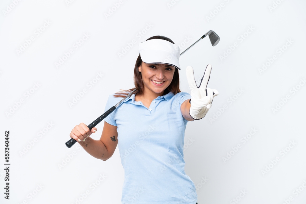 Young caucasian woman playing golf isolated on white background smiling and showing victory sign Young caucasian woman playing golf isolated on white background smiling and showing victory sign