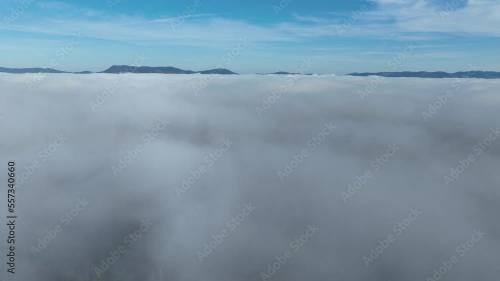 Drone flight over the clouds during sunrise. Fly through the clouds. Fresh morning and amazing sun rays over cloudscape. Drone flight over the clouds during sunrise. Fly through the clouds. Fresh morning and amazing sun rays over cloudscape.