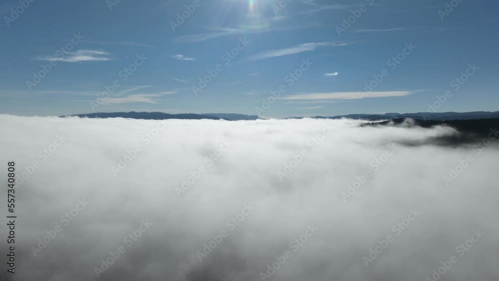 Drone flight over the clouds during sunrise. Fly through the clouds. Fresh morning and amazing sun rays over cloudscape. Drone flight over the clouds during sunrise. Fly through the clouds. Fresh morning and amazing sun rays over cloudscape.