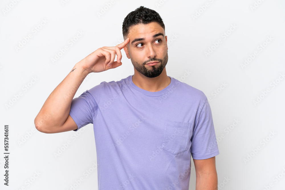 Young Arab handsome man isolated on white background making the gesture of madness putting finger on the head Young Arab handsome man isolated on white background making the gesture of madness putting finger on the head