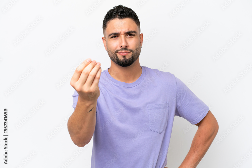 Young Arab handsome man isolated on white background making Italian gesture Young Arab handsome man isolated on white background making Italian gesture