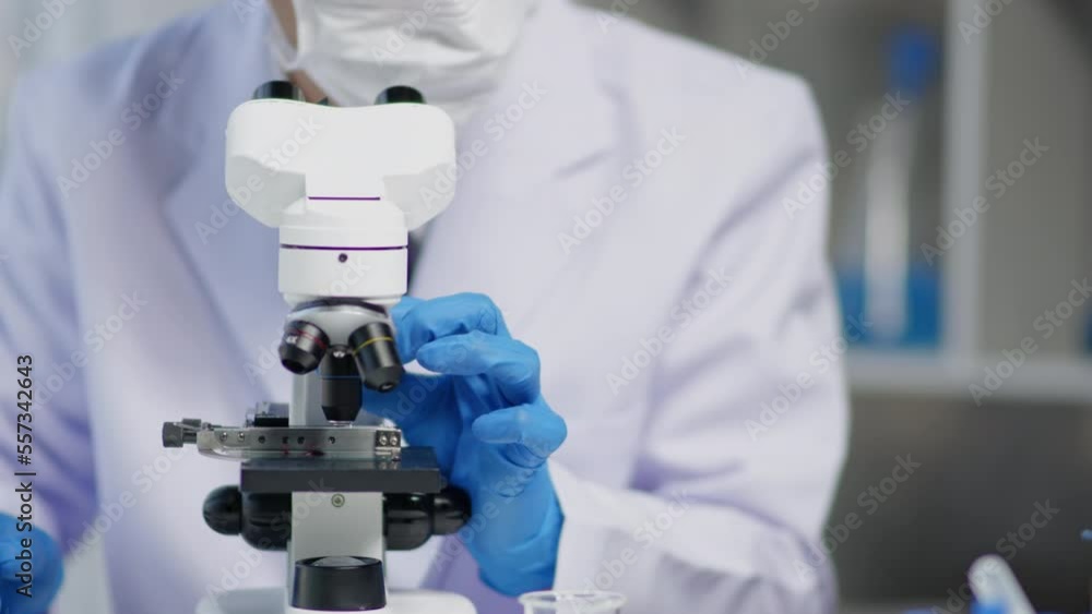Team scientists is working on chemistry and biology tests and using microscope in laboratory for develop and analysis virus vaccine and pharmacy medicine. Team scientists is working on chemistry and biology tests and using microscope in laboratory for develop and analysis virus vaccine and pharmacy medicine.