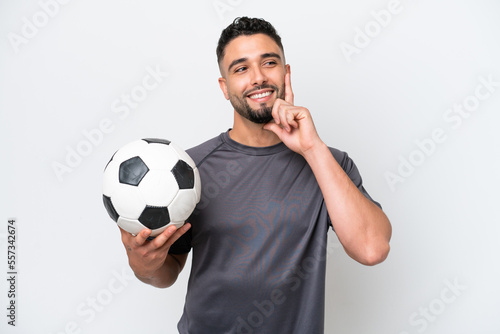 Arab young football player man isolated on white background thinking an idea while looking up