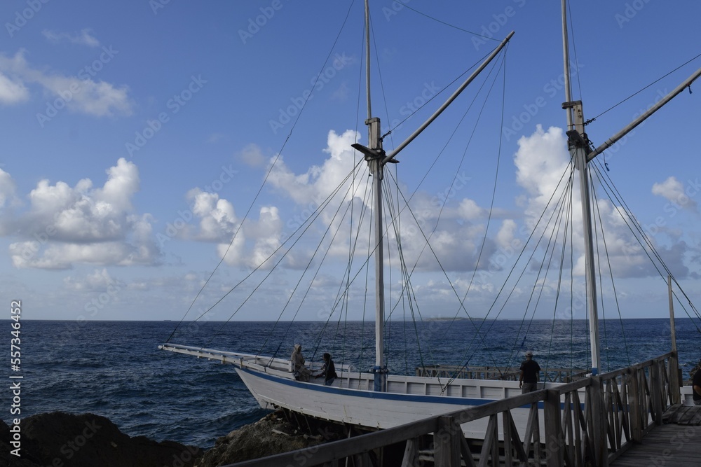 Wooden boat on a cliff to take pictures and enjoy the sea view in the tourist area of Tanjung Bira Indonesia. asian travel