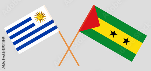 Crossed flags of Uruguay and Sao Tome and Principe. Official colors. Correct proportion