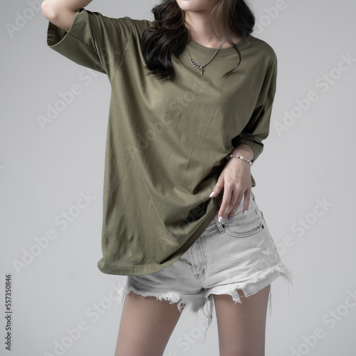 Woman wearing colorful t-shirt on gray background