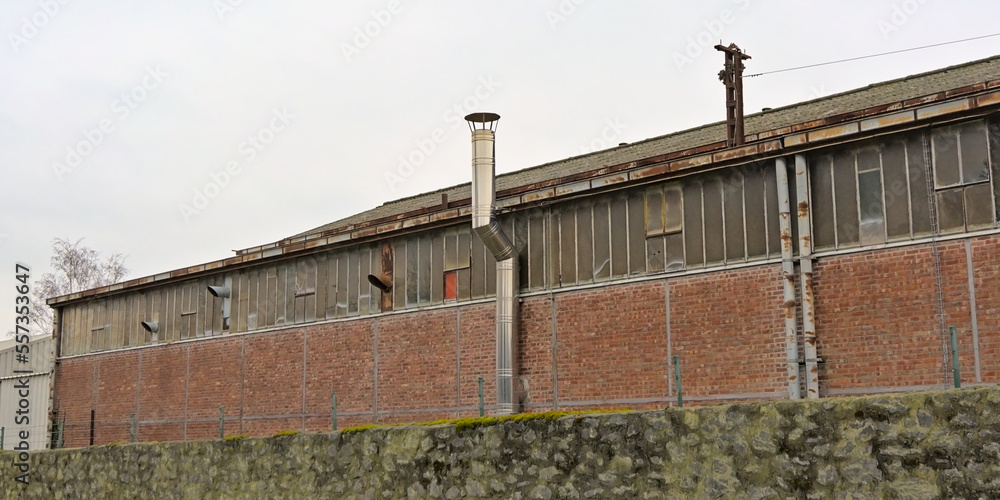 Old brick stone factory building with chimneys Old brick stone factory building with chimneys