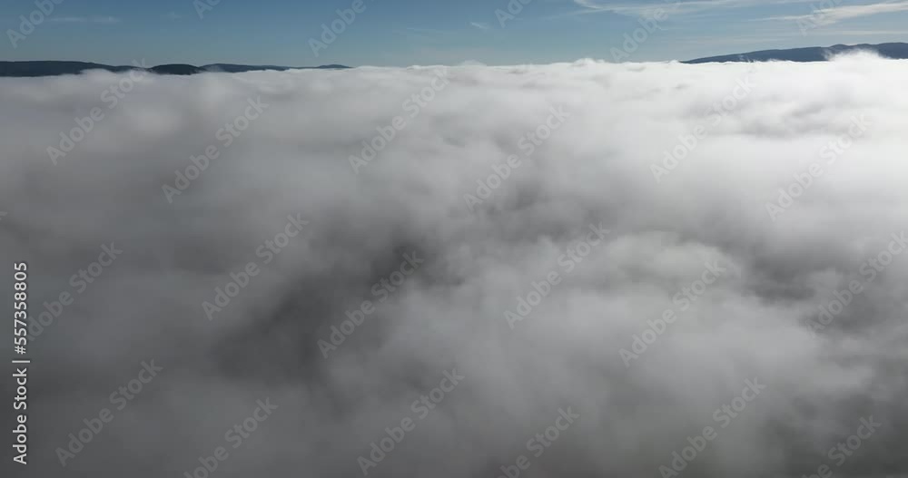 Drone flight over the clouds during sunrise. Fly through the clouds. Fresh morning and amazing sun rays over cloudscape. Drone flight over the clouds during sunrise. Fly through the clouds. Fresh morning and amazing sun rays over cloudscape.