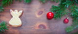 Christmas background with decorations and cookie on wooden board