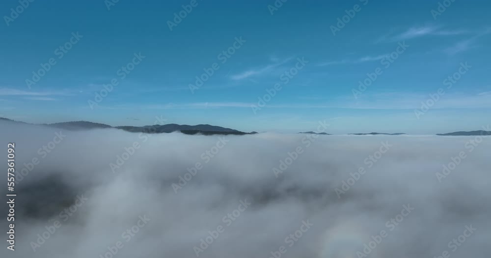 Drone flight over the clouds during sunrise. Fly through the clouds. Fresh morning and amazing sun rays over cloudscape. Drone flight over the clouds during sunrise. Fly through the clouds. Fresh morning and amazing sun rays over cloudscape.