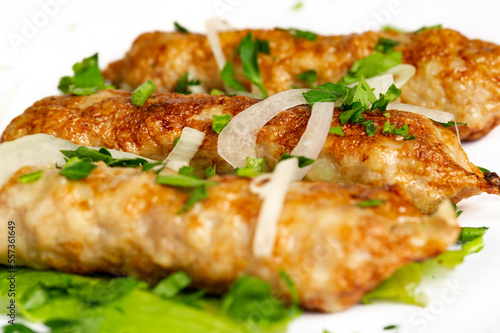 closeup of chicken lula kebab on white background