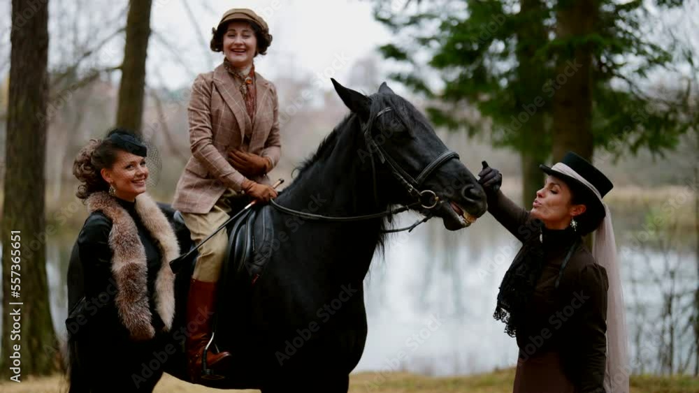 three noblewomen are resting in royal garden, riding and playing with horse, 19 century style three noblewomen are resting in royal garden, riding and playing with horse, 19 century style