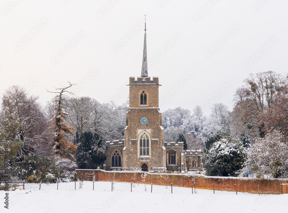 Traditional English village church covered in Snow. St Andrews Church, Much Hadham, Hertfordshire. UK