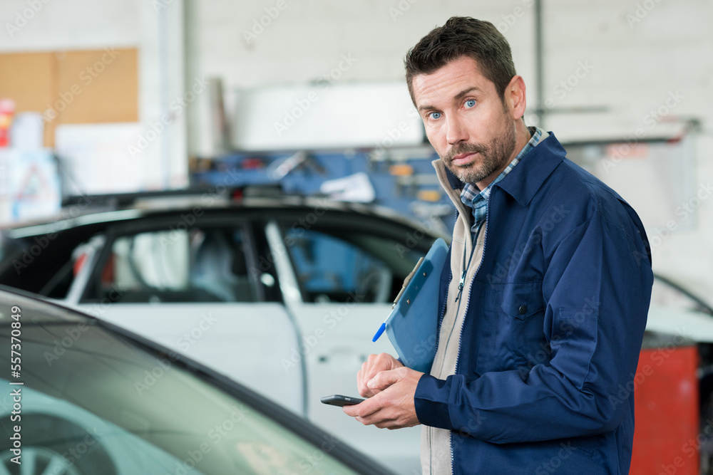mechanic man checking problem on the phone mechanic man checking problem on the phone