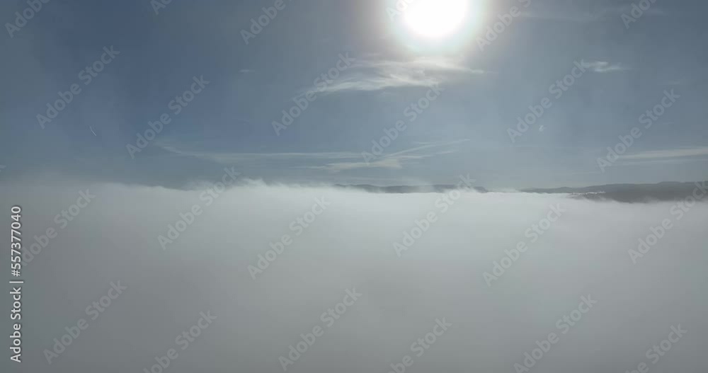 Drone flight over the clouds during sunrise. Fly through the clouds. Fresh morning and amazing sun rays over cloudscape. Drone flight over the clouds during sunrise. Fly through the clouds. Fresh morning and amazing sun rays over cloudscape.