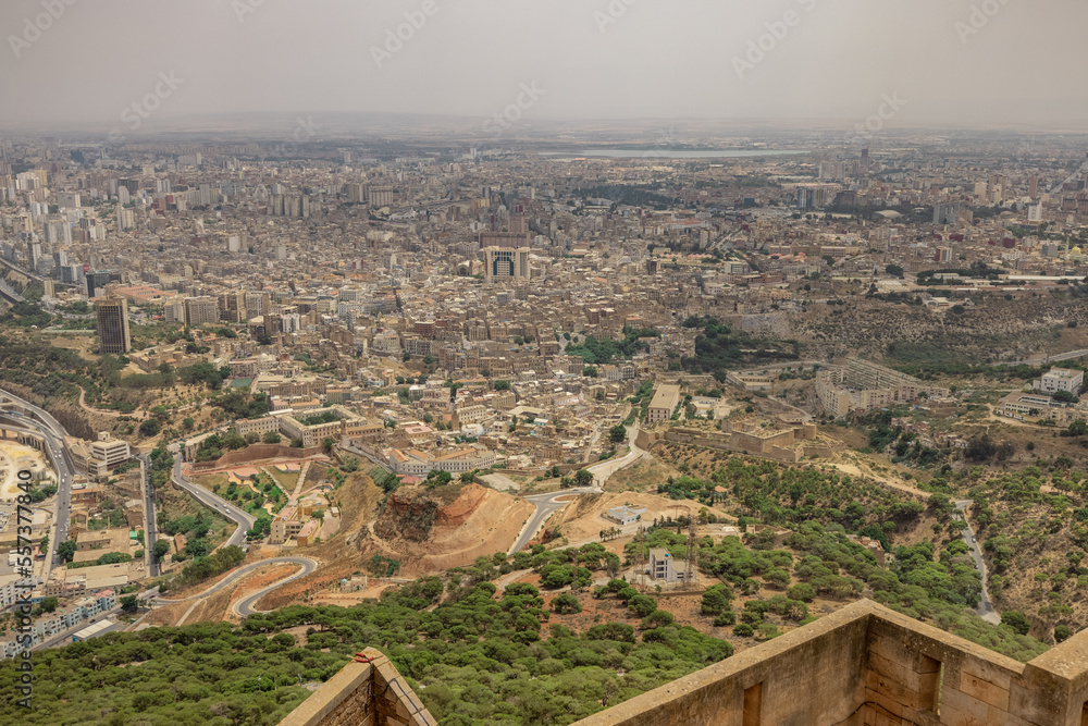 Panoramic view of Oran city from Santa Cruz fortress, one of the three forts in Oran, the second largest port of Algeria; Summer day, looking from high above towards the city.