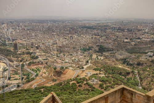 Panoramic view of Oran city from Santa Cruz fortress, one of the three forts in Oran, the second largest port of Algeria; Summer day, looking from high above towards the city. photo