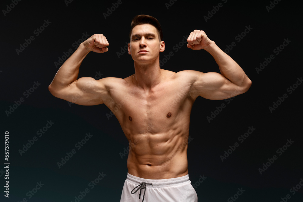 Portrait of handsome shirtless man looking to camera while standing Portrait of handsome shirtless man looking to camera while standing