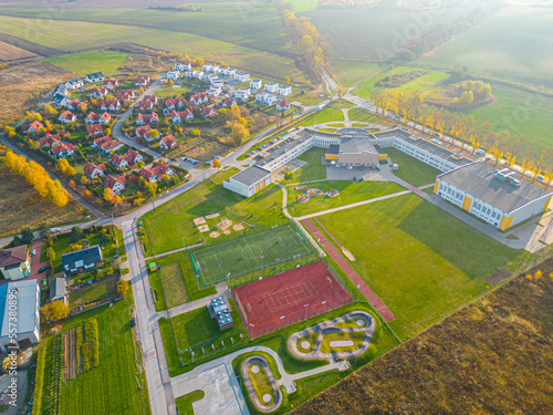 Aerial view of small european town with sradium and sport field  panorama