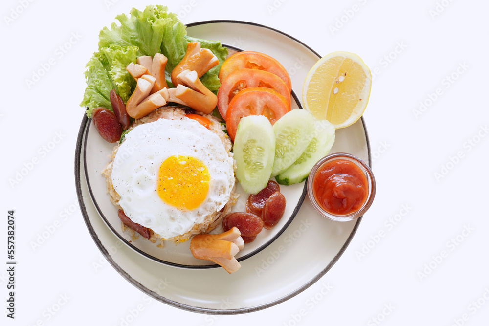 Fried rice and hot dogs, cooked fried egg, Chinese sausage and ketchup on a white background. Fried rice and hot dogs, cooked fried egg, Chinese sausage and ketchup on a white background.