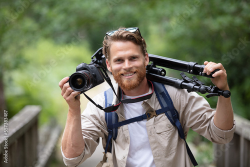 man photographer hand holding dslr camera