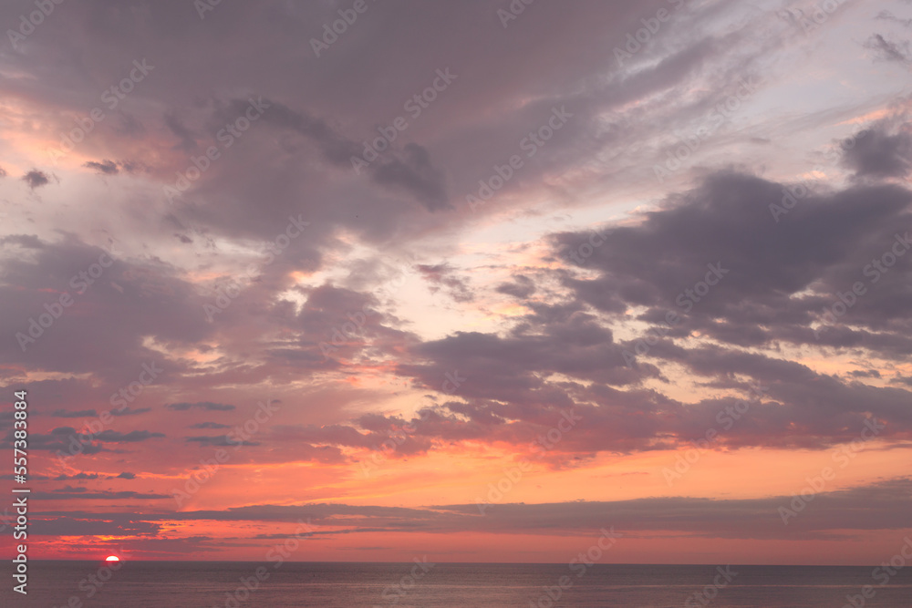 Beautiful sunset sky with pink cloud on the sea.
