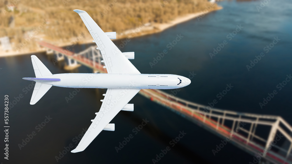 Fototapeta premium plane flies above the landscape. Side view of aircraft. Travel and transportation concept.