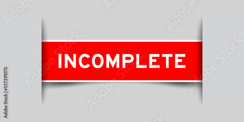 Green color square label sticker with word incomplete that inserted in gray background