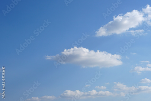 Blue sky with fluffy white clouds constantly changing shape.