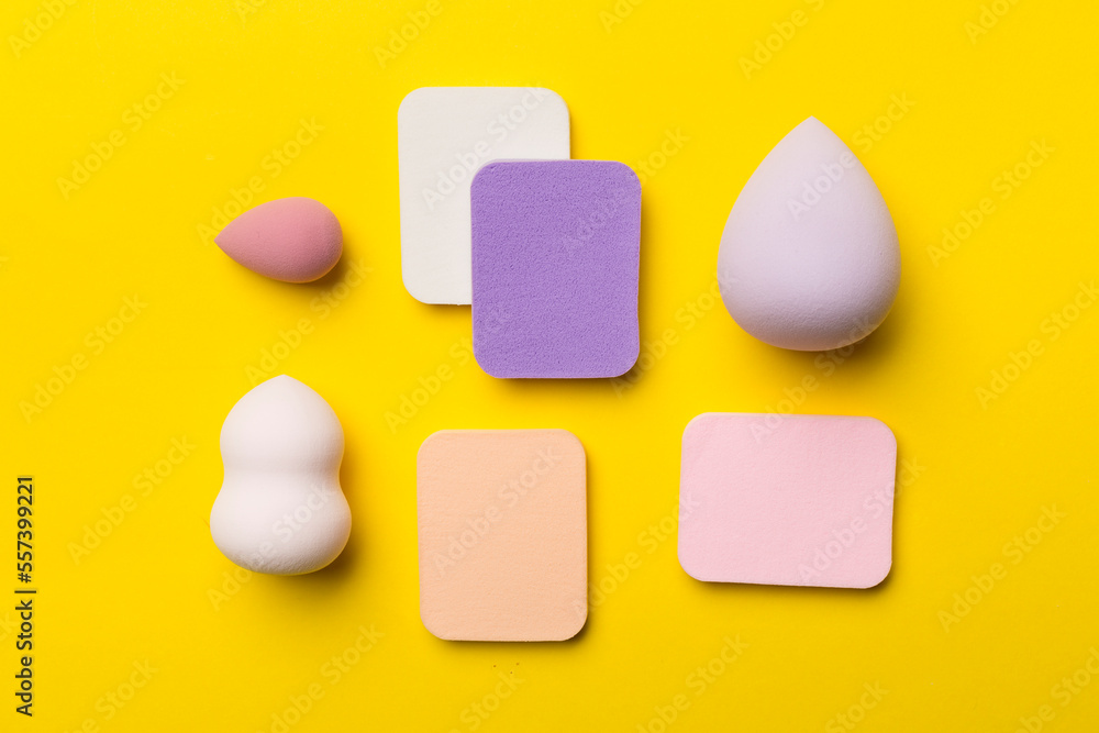Beauty blenders on color background, top view Beauty blenders on color background, top view