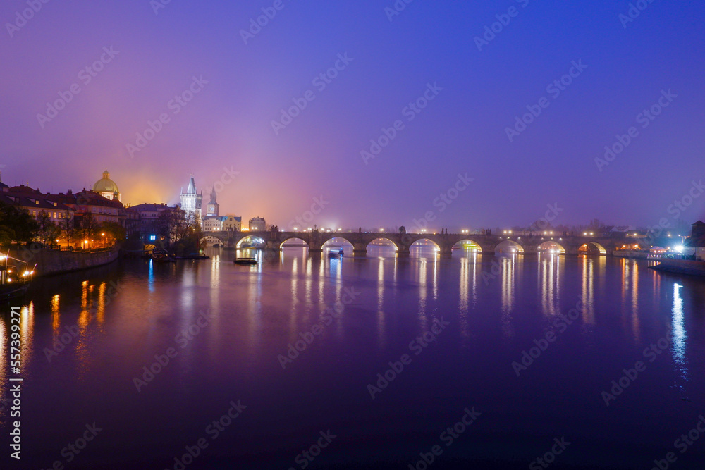 Charles Bridge Prague in foggy evening
