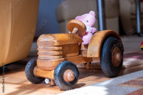 Rabbit on toy tractor out of wood