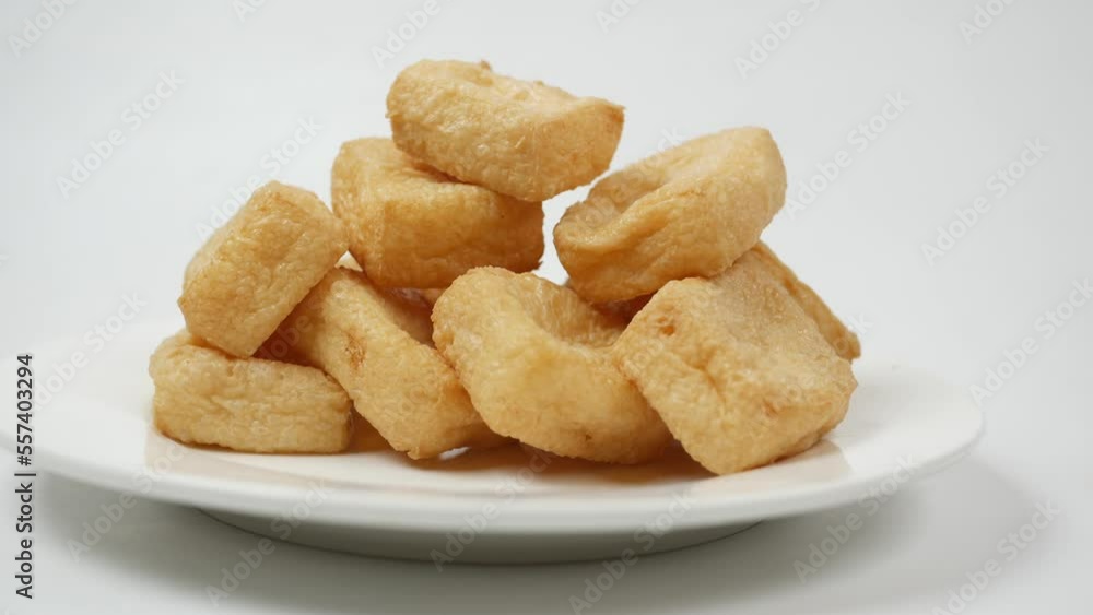 stack of fried tofu on a plate on white background stack of fried tofu on a plate on white background