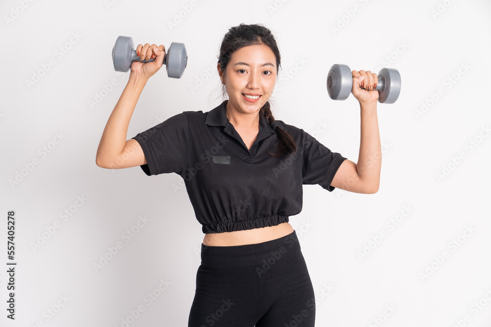 woman smiling while lifting dumbbells exercising shoulder muscles on white background woman smiling while lifting dumbbells exercising shoulder muscles on white background