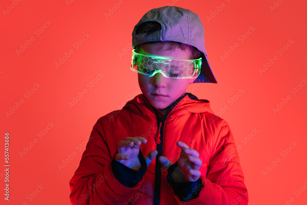 Futuristic boy interacting with digital interface Futuristic boy interacting with digital interface