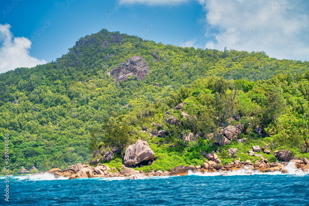 Mountains and vegetation of a beautiful tropical island as seen from the ocean