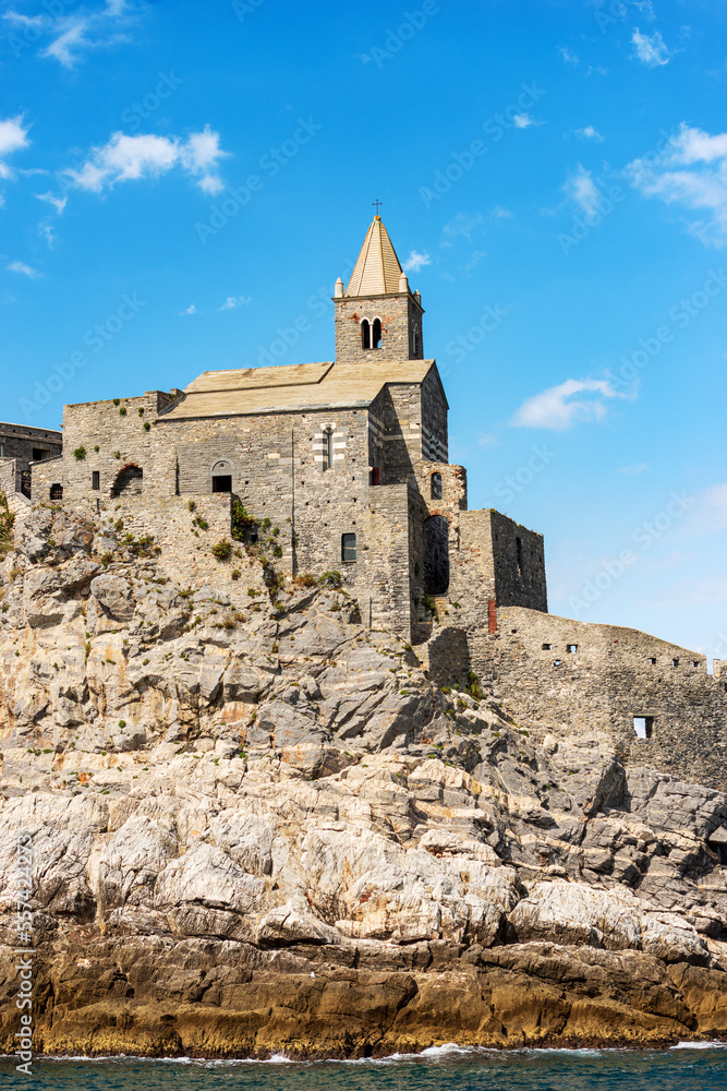 Headland in Portovenere or Porto Venere with the medieval church of San Pietro (St. Peter, 1198), UNESCO world heritage site. La Spezia, Liguria, Italy, Europe. Headland in Portovenere or Porto Venere with the medieval church of San Pietro (St. Peter, 1198), UNESCO world heritage site. La Spezia, Liguria, Italy, Europe.
