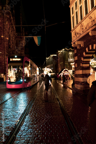 The Old City of Bremen during the holidays season, Christmas market in Bremen, Die Sögestrasse, street of Bremen with light reflexion after the rain, people in Xmas Market